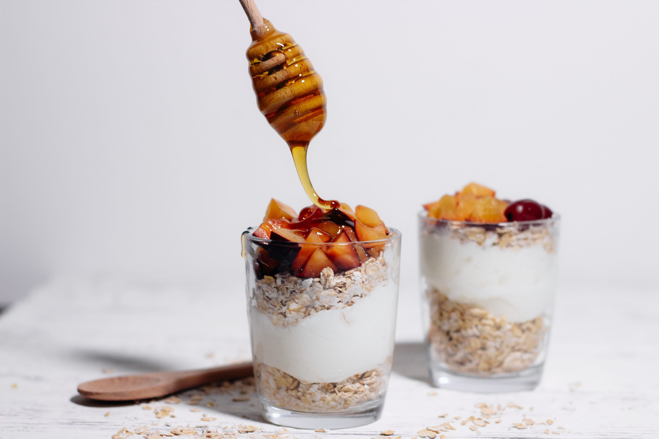 Oatmeal,With,Fruits,And,Honey,On,A,White,Background